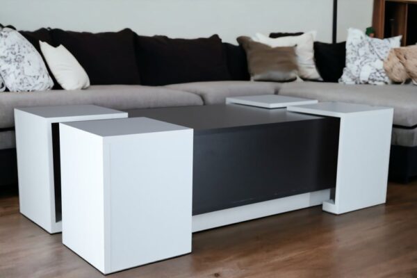 A set of coffee tables and service tables from Nate Home with an elegant black and white design